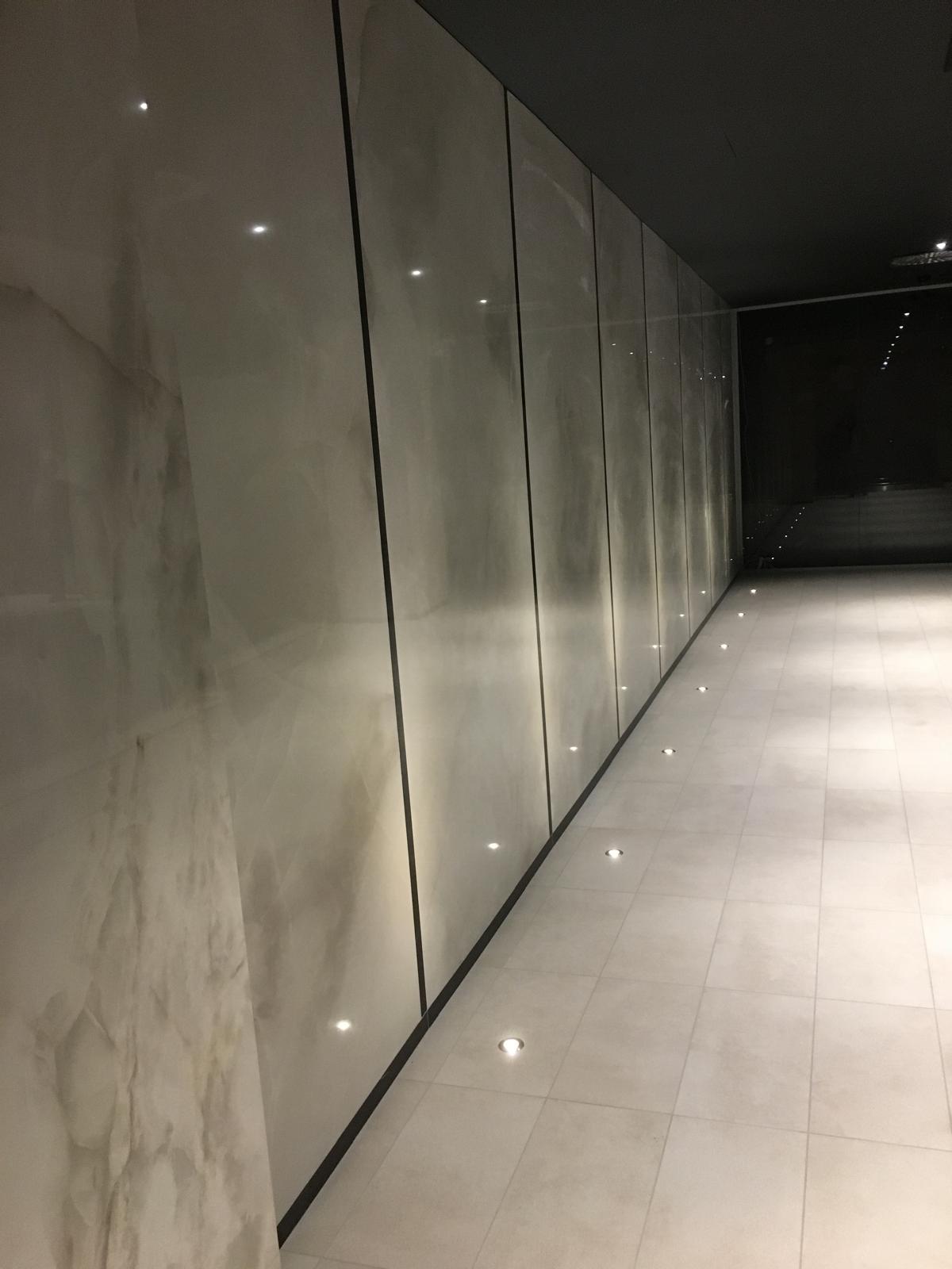 Marble wall panels with floor uplighting